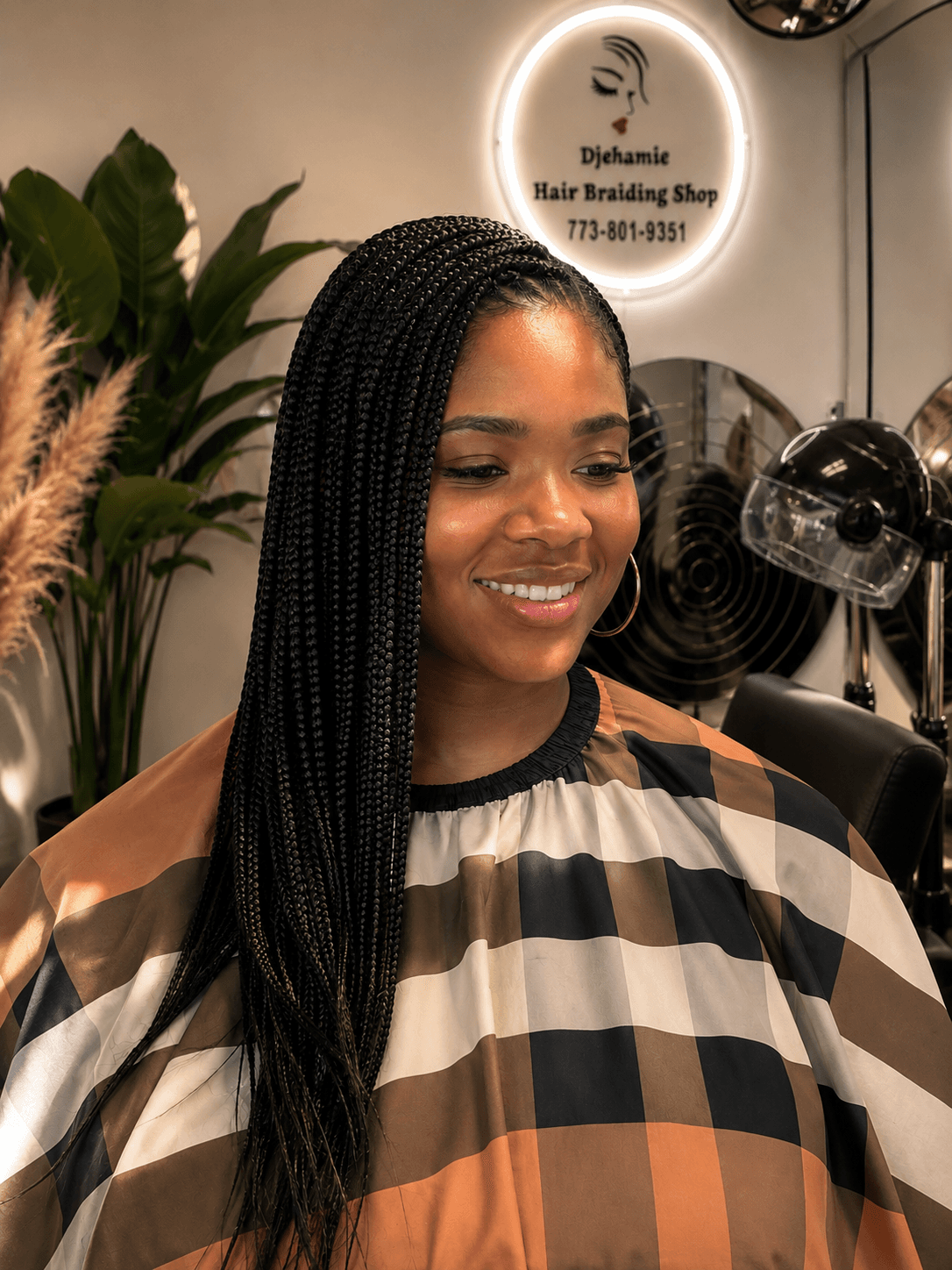 Black knotless braids worn to the side